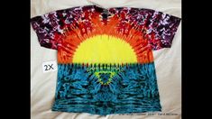 an image of a tie dyed shirt with the sun on it