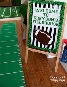 a football themed welcome sign in the middle of a room