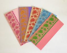 five different colored cards with paisley designs on them