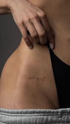 a woman's stomach with the word sorry written in cursive writing on it