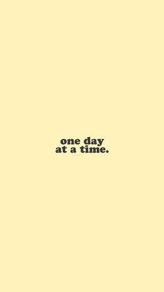 the words one day at a time are written in black on a light yellow background