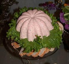 a cake made to look like a bun with lettuce on it