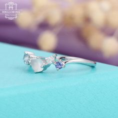 Moonstone Engagement ring white gold Diamond Cluster Ring Tanzanite Aquamarine Wedding Pristine Promise Birthstone Anniversary gifts for her≫≫ Item Details❀❀❀ Make every ring to order, all rings are handmade in the United States.❀❀❀ Metal(Nickel Free): Solid 14K & 18K Gold❀❀❀ Gold Color: Rose gold, Yellow gold, White gold❀❀❀ Moonstone & Tanzanite & Aquamarine & Natural conflict-free Diamond Natural conflict-free Diamond :about 0.1CT❀❀❀ Ring band:about 1.6mm(width),1.2mm(thickness)❀❀❀ Gem: about Anniversary White Gold Multi-stone Topaz Ring, White Multi-stone Moonstone Ring For Formal Occasions, Formal White Multi-stone Moonstone Ring, Diamond Moonstone Ring In White Gold For Anniversary, White Gold Multi-stone Crystal Anniversary Ring, 14k White Gold Topaz Ring For Wedding, White Gold Moonstone Ring With Accent Stones For Anniversary, White Gold 14k Topaz Wedding Ring, White Multi-stone Moonstone Promise Ring