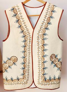 This wool vest was handmade and hand embroidered by an artist from Kazakhstan, a nomadic country, south of Russia. The artistry of Kazakhstan is famed for its authenticity and adherence to ancient art.Materials: handmade 100% Merino wool , cotton & wool threads, and cotton lining. Size: Medium pit-to-pit-21", back-29" Embroidered Coat, Wool Thread, Vintage Vest, Wool Vest, Cotton Wool, Mens Vest, Ancient Art, An Artist, Mens Coats