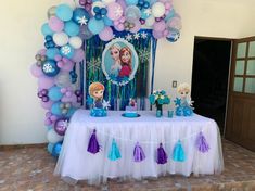 a frozen princess birthday party with balloons and decorations