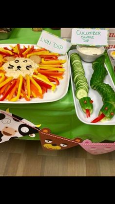 a table topped with plates filled with different types of vegetables and food on top of it