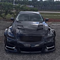 the front end of a black sports car