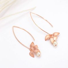 Rose Gold Pearls Dangle Earrings Orchid Flower pink Teardrop Rose Gold Flower Earrings With Pearl Drop For Wedding, Rose Gold Pearl Drop Flower Earrings For Wedding, Delicate Rose Gold Pearl Earrings For Party, Delicate Rose Gold Pearl Earrings For Wedding, Minimalist Matching Flower Earrings For Wedding, Minimalist Wedding Flower Earrings, Minimalist Flower Earrings For Wedding, Delicate Rose Gold Flower Bridal Earrings, Feminine Rose Gold Wedding Earrings