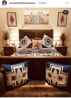 a bed with two pillows on top of it and pictures above the bedspread