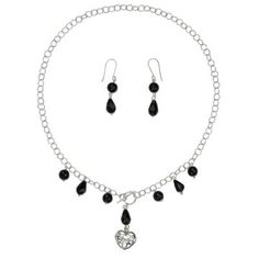 Sleek black globes of faceted agate alternate with black glass briolettes in this elegant jewelry set. By Alejandra Torres the necklace features a toggle clasp that fastens in front just above a lacy heart pendant. The Mexican artisan works in sterling silver. Black Heart Beads Dangle Jewelry, Black Metal Jewelry With Heart Beads, Black Heart Beads For Jewelry Making, Elegant Heart-shaped Black Beads Jewelry, Silver Heart Jewelry, Black Globe, Heart Jewelry Set, Bead Pendant, Silver Jewellery Sets