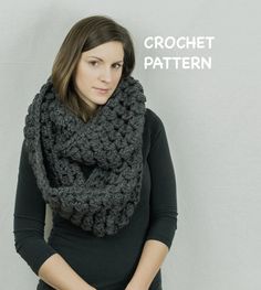 a woman wearing a gray crochet scarf with the words crochet pattern on it