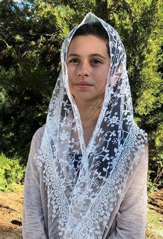 This Chapel Veil is Beautifully Handmade of Sheer Cherry Blossom Lace and Trim It is my Hope for women to return to the tradition of wearing a head covering in church. So if I wanted one, I would have to make it myself, and I did. My Mission is to try and reignite in our hearts the love for our faith, and the Presence of Christ in the Eucharist. I want to invite women to proclaim their faith in the Real Presence by making an external sign of their inner desire to humble before God. When women ve Traditional White Veil, Hijab Styles For Party, Veil Scarf, Chapel Veil Catholic, Veil Mantilla, Catholic Veil, Lace Mantilla, Mantilla Veil, Vintage Veils