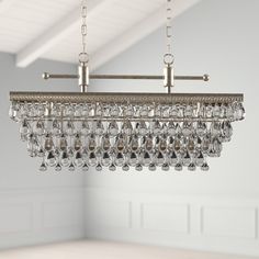 a chandelier hanging from a ceiling in a room