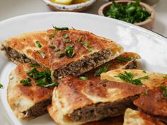 some food is on a white plate with other dishes in the backgroung