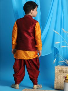 JBN CREATION Boy's Maroon Embroidered Nehru Jacket With Orange Kurta And Maroon Dhoti Set Dress your little one in sophisticated style with this JBN Creation set. Featuring a maroon embroidered Nehru jacket, a vibrant orange kurta, and a matching maroon dhoti, this ensemble is perfect for special occasions and traditional ceremonies. Key Features Maroon embroidered Nehru jacket with mandarin collar Contrasting orange kurta with full sleeves and knee length Maroon dhoti for a complete traditional Embroidered Multicolor Winter Sets, Festival Long Sleeve Bandhgala For Puja, Long Sleeve Bandhgala For Festivals, Long Sleeve Bandhgala For Puja And Navratri, Bollywood Style Festive Winter Sets, Winter Bollywood Traditional Wear With Pallu, Bollywood Traditional Wear With Pallu For Winter, Multicolor Nehru Jacket With Zari Work For Diwali, Embroidered Kurta With Stand Collar For Festivals