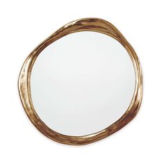 a round mirror with gold paint on the edges and an oval frame in the middle