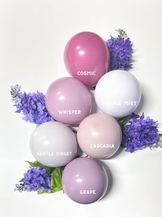 purple and white balloons with the words cosmic, whisper, castle violet, crapa