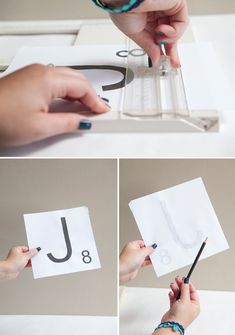 someone is doing something with paper and scissors to make it look like the letter j