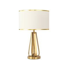 a gold table lamp with a white shade