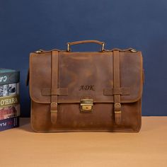 "ABOUT THE ITEM:   - This briefcase is made of 100% full grain leather. - The briefcase dimensions  is  15.7 X 11 X 5.5 Inches - Solid metal zipper, high quality metal hardware - Briefcase comes with a large adjustable shoulder strap (33\"-58\"). - Briefcase fits laptops, tablets and devices up to 15 inches." Classic Leather Satchel Case, Leather Saddle Bag With Smooth Grain For Business, Vintage Leather Case For Business Trips, Vintage Leather Cases For Business Trips, Vintage Leather Business Cases, Luxury Briefcase With Waxed Finish, Formal Leather Satchel With Waxed Finish, Formal Brown Briefcase With Waxed Finish, Classic Leather Saddle Bag With Leather Backing