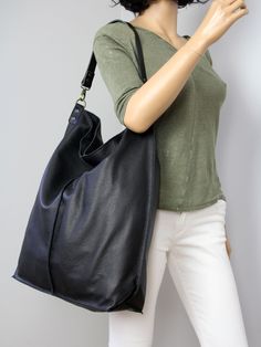 Black leather hobo bag with zipper- everyday soft bag. **Dimensions Height: 18,5 inch (47 cm) Width: 18,1 inch (46 cm) Length of handle: 19,3 inch (49 cm) Bottom width: 13,4x 5,9 inch (34x15 cm) Internal pocket: 8,7x 6,7inch (22 x 17 cm) Large, very roomy bag made of thick yet soft cattle leather. The bag can be worn as a shoulder bag. Detachable shoulder strap. There is a lot of space and you can put there everything in your everyday life. It has a top zip closure. Add this gorgeous bag to your Black Hobo Bag With Zipper Pocket For On-the-go, Versatile Black Hobo Bag, Black Hobo Bag With Large Capacity, Black Canvas Hobo Bag For Daily Use, Black Hobo Bag For Travel, Black Hobo Travel Bag, Large Capacity Black Hobo Bag, Black Hobo Bag With Zipper Pocket, Versatile Black Hobo Bag For Everyday