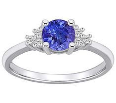 Combining classic elegance and endless glam sparkle, this tanzanite and diamond ring is sure to turn heads wherever you go. From Affinity® Gems. Round Cut Diamond Treated Tanzanite Jewelry, Multi-stone Tanzanite Round Ring, Tanzanite Multi-stone Round Cut Rings, Luxury Round Tanzanite Gemstones, Tanzanite And Diamond Ring, Round Multi-stone Tanzanite Gemstones, Tanzanite Diamond Ring, Tanzanite Diamond, Classic Elegance