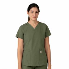 Ditch your outdated women’s scrubs and start every shift in comfort in the Carhartt Force Essentials 5-Pocket V-Neck Scrub Top. This stylish women’s scrub top is made with sustainable lightweight fabric and features the long trusted Carhartt Scrubs Rugged Flex Stretch Technology that provides unmatched comfort and durability. Designed for women who want a more tailored fit, this Carhartt top has a classic v-neckline along with back princess seaming and a shirttail hem to complete that tailored, Carhartt Scrubs, Carhartt Womens, Safety Clothing, Working People, Feminine Look, Scrub Tops, Princess Seam, Summer Essentials, Modern Fit