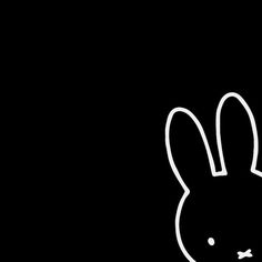 a black and white drawing of a rabbit's head on a dark background,