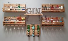 several wooden shelves filled with bottles and glasses