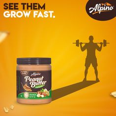 an advertisement for peanut butter with a silhouette of a man holding a barbell in front of him