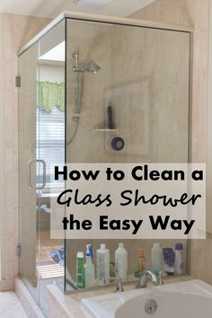 a bath tub sitting under a window next to a sink and shower with the words how to clean a glass shower the easy way