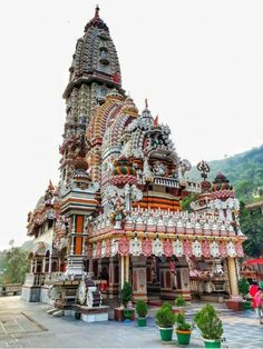 an elaborately decorated building in the middle of a park