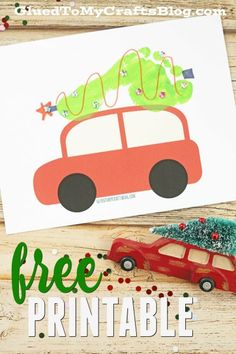 a red car with a christmas tree on top is sitting next to a card that says free printable