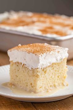 a close up of a piece of cake on a plate with the words tres leches cake rich, moist & authentic mexican dessert