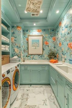 a washer and dryer in a room with floral wallpaper on the walls