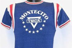 Chest 16 in.  Length 26 in.   Tag Says: No tag  This shirt is a jersey promoting the Montecito Family YMCA in Santa Barbara, California. This jersey was made back in the 50s, and during that decade World YMCA elected their first black president, Charles Dunbar Sherman from Liberia.   Comments: Fits like a modern unisex adult small, feels like rayon, wear around the seams, see pics           JERSEY-127235 Sports Crew Neck Top With Front Print, Fitted Blue T-shirt For Sports Events, Fitted Graphic Print Jersey T-shirt, Fitted Jersey T-shirt With Graphic Print, Retro Blue Sports T-shirt, Blue Jersey Top For Streetwear, Fitted Cotton T-shirt For Sports Events, Sporty Top With Front Print For Sports Events, Blue Retro T-shirt For Sports Events