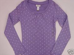 (1) NWT New With Tags Limited Too re branded as Justice Long Sleeve LS Dot Tee Passionflower / Purple / Lavender Popular Top with Allover Dot Print as shown in photo Size 10 95% cotton / 5% spandex   21 in shoulder to bottom hemline  13 in across armpits  15 1/2 in underarm to end of sleeve Retails $29.50 Our home is both smoke & pet free Lavender Long Sleeve Shirt, Purple Long Sleeve Top With Graphic Print, Lavender Long Sleeve Cotton Top, Purple Long Sleeve Printed Shirt, Limited Too, Purple Relaxed Fit Long Sleeve T-shirt, Purple Pattern, Photo Size, Purple Lavender