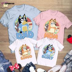 three tshirts with cartoon characters on them and the words dad, mom, and son