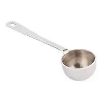 a white measuring cup with a spoon in it