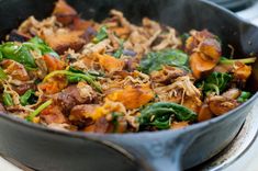 a skillet filled with food sitting on top of a stove