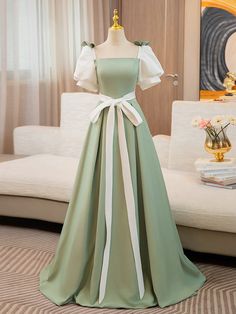 Fitted Puff Sleeve Dress For Debutante Ball, Green Puff Sleeve Dress For Wedding, Green Spring Dress For Debutante Ball, Green Dress For Debutante Ball In Spring, Green Princess Style Bridesmaid Dress, Princess Style Green Bridesmaid Dresses, Elegant Fitted Princess Dress With Puff Sleeves, Green Square Neck Wedding Dress, Green Square Neck Dress For Wedding