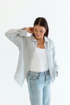 Stay cool and stylish this summer with our Zuma Button Down, featuring pretty iridescent buttons and a raw hem. This super lightweight top offers an effortless, relaxed, and roomy fit, making it perfect for warm weather. Best of all? Its 100% cotton! Wear it buttoned up for a polished look or unbuttoned over a swimsuit or tank for a breezy, casual vibe. This versatile piece is a must have summer staple! Malibu Collection FIT Relaxed Roomy Fit Iridescent Buttons High-Low Raw Hem Clancy is 5'9 Wea Oversized Loungewear Tops With Button Closure, Oversized Button Closure Top For Loungewear, Summer Buttoned Tops For Loungewear, Summer Tops With Buttons For Loungewear, Spring Loungewear Shirt With Button Closure, Casual Buttoned Shirt For Loungewear, Casual Loungewear Shirt, Oversized Buttoned Tops For Loungewear, Relaxed Fit Top With Buttons For Loungewear