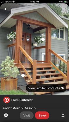 a porch with stairs and railings in front of a house that has flowers on it