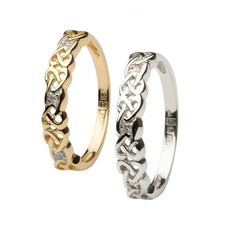 two wedding rings with different designs on each ring, one in gold and the other in silver