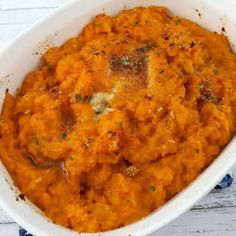 a white bowl filled with mashed sweet potatoes