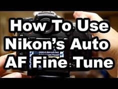 a person holding up a camera with the words how to use nikon's auto af fine tune