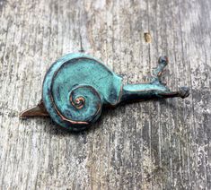 a close up of a metal object on a wooden surface