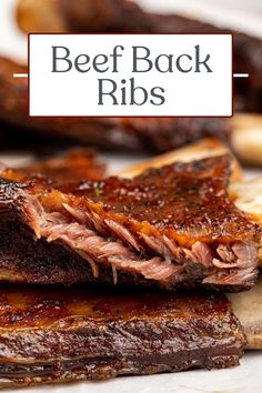 beef back ribs with bbq sauce on top and the words beef back ribs above it