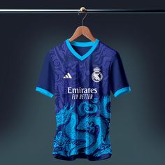 a soccer jersey hanging on a clothes line with a hanger in front of it