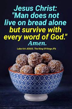 a blue and white bowl filled with food on top of a table next to a bible quote